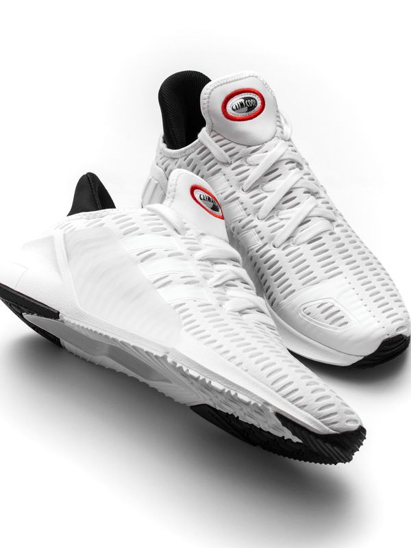 A pair of white leather sneakers